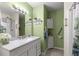 Well-lit bathroom featuring a vanity with a white countertop and an accessible shower/tub combo at 19370 Saint Benedict Dr, Dunnellon, FL 34432