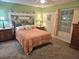 Charming bedroom featuring vintage furniture, soft lighting, and colorful accents at 19370 Saint Benedict Dr, Dunnellon, FL 34432