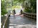 Visitors on the boardwalk prepare to enjoy the cool waters of Blue Run of Dunnellon Park at 19370 Saint Benedict Dr, Dunnellon, FL 34432
