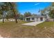 Charming single-story home featuring a well-maintained front yard and an inviting entrance at 19370 Saint Benedict Dr, Dunnellon, FL 34432