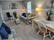 Comfortable living and dining area with stylish furniture and decor, creating a warm and inviting atmosphere at 19370 Saint Benedict Dr, Dunnellon, FL 34432