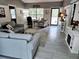 Inviting living room with stylish furniture, large windows, and modern decor, perfect for relaxing and entertaining at 19370 Saint Benedict Dr, Dunnellon, FL 34432
