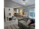 Spacious living room flows into the dining area, offering comfortable seating and a bright, open layout at 19370 Saint Benedict Dr, Dunnellon, FL 34432