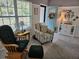 Cozy living room with comfortable seating, a bright window, and stylish decor, creating a welcoming atmosphere at 19370 Saint Benedict Dr, Dunnellon, FL 34432