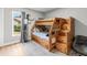bedroom featuring a wooden bunkbed with built-in storage and natural light at 19942 Sw 96Th Pl, Dunnellon, FL 34432