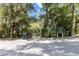 View of canoe and kayak launch area with signage and easy water access, surrounded by serene natural setting at 19942 Sw 96Th Pl, Dunnellon, FL 34432