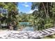 View of a local swimming area surrounded by lush greenery, perfect for a refreshing swim in a natural environment at 19942 Sw 96Th Pl, Dunnellon, FL 34432