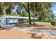 View of community pavilion with picnic tables, perfect for gatherings and outdoor events at 19942 Sw 96Th Pl, Dunnellon, FL 34432