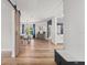Open-concept space featuring a dining area, hallway, and a decorative barn door at 19942 Sw 96Th Pl, Dunnellon, FL 34432