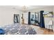 Spacious primary bedroom with stylish decor, sliding glass doors to patio and a comfortable atmosphere at 19942 Sw 96Th Pl, Dunnellon, FL 34432