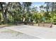 Designated accessible parking with picnic tables and natural landscaping in a park setting at 19942 Sw 96Th Pl, Dunnellon, FL 34432