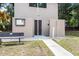 Exterior of community restrooms with an accessible path, bench, and information board at 19942 Sw 96Th Pl, Dunnellon, FL 34432