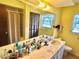 Spacious bathroom features a dual sink vanity and a shower/tub combo at 20100 Sw 95 St, Dunnellon, FL 34431