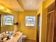 Bright bathroom features a window with natural light and a traditional vanity at 20100 Sw 95 St, Dunnellon, FL 34431