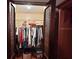 Organized closet with wooden louvered doors and wire shelves at 20100 Sw 95 St, Dunnellon, FL 34431