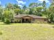 Charming single-story home with a covered front porch and large yard at 20100 Sw 95 St, Dunnellon, FL 34431