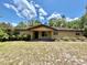 Charming single-story home with a covered front porch and well-maintained landscaping at 20100 Sw 95 St, Dunnellon, FL 34431