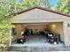 Open garage showcasing storage, tools, and ample workspace at 20100 Sw 95 St, Dunnellon, FL 34431