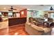 Spacious living room and kitchen featuring laminate floors and modern appliances at 20100 Sw 95 St, Dunnellon, FL 34431