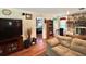 Inviting living room with laminate floors, fireplace and cozy seating area at 20100 Sw 95 St, Dunnellon, FL 34431
