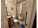 Bathroom with a tiled shower and vanity with granite countertop at 27 Cedar Tree Ter, Ocala, FL 34472