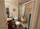 Bathroom featuring tiled shower, granite countertops, and modern fixtures at 27 Cedar Tree Ter, Ocala, FL 34472