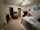 Bedroom features neutral carpet, furnishings and ample storage at 27 Cedar Tree Ter, Ocala, FL 34472
