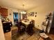Cozy dining room featuring a chandelier and sliding glass doors to the outside at 27 Cedar Tree Ter, Ocala, FL 34472