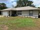 Inviting single-story home showcasing manicured landscaping and an attached two-car garage at 27 Cedar Tree Ter, Ocala, FL 34472