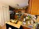 Kitchen with stainless steel appliances and wooden cabinets at 27 Cedar Tree Ter, Ocala, FL 34472