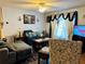 Inviting living room with natural light, comfortable seating, and stylish decor at 27 Cedar Tree Ter, Ocala, FL 34472