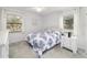 Comfortable bedroom with natural light and white furniture at 2701 Ne 10Th St # 101, Ocala, FL 34470