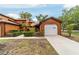 Charming exterior view of home, featuring a one car garage and well maintained landscaping at 2701 Ne 10Th St # 101, Ocala, FL 34470