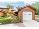 Charming exterior view of home, featuring a one car garage and well maintained landscaping at 2701 Ne 10Th St # 101, Ocala, FL 34470