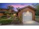 Charming exterior view of home at dusk, featuring a one car garage and landscaping at 2701 Ne 10Th St # 101, Ocala, FL 34470