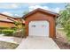 Detached one-car garage with a driveway and a well-maintained exterior at 2701 Ne 10Th St # 101, Ocala, FL 34470