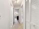 Well-lit hallway with closets, providing access to rooms in the home at 2701 Ne 10Th St # 101, Ocala, FL 34470