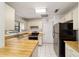 Traditional kitchen featuring stainless steel appliances, light wood countertops and white cabinetry at 2701 Ne 10Th St # 101, Ocala, FL 34470