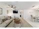Open-concept living space with modern decor, seamlessly connecting the kitchen and dining area at 2701 Ne 10Th St # 101, Ocala, FL 34470