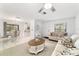 Inviting living room and dining area with neutral tones, tile flooring, and ample natural light at 2701 Ne 10Th St # 101, Ocala, FL 34470