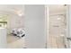 Relaxing primary bedroom with adjoining bathroom featuring tiled shower and ample natural light at 2701 Ne 10Th St # 101, Ocala, FL 34470