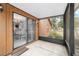 Relaxing screened patio overlooking the yard, accessible from the dining area at 2701 Ne 10Th St # 101, Ocala, FL 34470