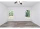 Bright, unfurnished bedroom featuring modern wood flooring and windows with natural light at 3270 Sw 151St Ct, Ocala, FL 34481