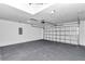 Spacious garage with epoxy floor, garage door, and ample space for parking and storage at 3270 Sw 151St Ct, Ocala, FL 34481