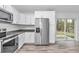 Well-equipped kitchen features stainless steel appliances, granite counters, and access to the backyard at 3270 Sw 151St Ct, Ocala, FL 34481