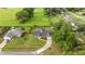 Charming home with trampoline and swing set in fenced-in yard, as seen from above at 380 Ne 53Rd St, Ocala, FL 34479