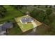 Aerial shot of a charming single-story home with spacious yard, fenced perimeter, and tree-lined property borders at 380 Ne 53Rd St, Ocala, FL 34479