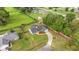 Beautiful aerial view of home with lush landscaping, fenced yard, and a long driveway at 380 Ne 53Rd St, Ocala, FL 34479