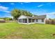 A spacious backyard with a screened-in porch offers great outdoor living space and privacy at 380 Ne 53Rd St, Ocala, FL 34479