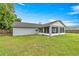 Expansive backyard featuring a screened-in porch, perfect for outdoor relaxation and entertaining at 380 Ne 53Rd St, Ocala, FL 34479